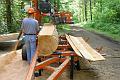 Lyle cutting timber using a Wood-Mizer portable mill for outbuilding construction